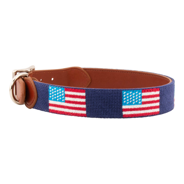 American Flag Needlepoint Dog Collar with navy blue background showing a  repeating pattern of evenly spaced American flags. The dog collar has durable stainless steel and full grain leather backing and strap.