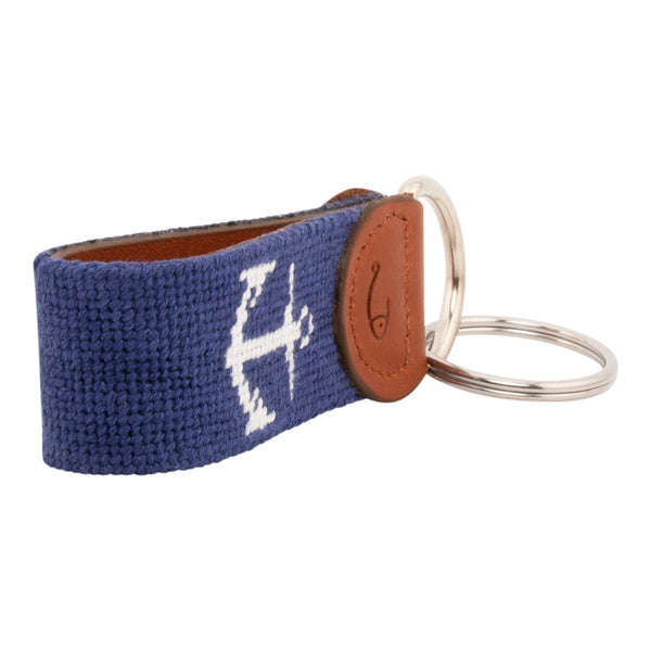 Hand-stitched needlepoint keychain, ship's anchor design in white on both sides with navy blue background high-quality leather and cotton thread, stainless steel D-ring and keyring.