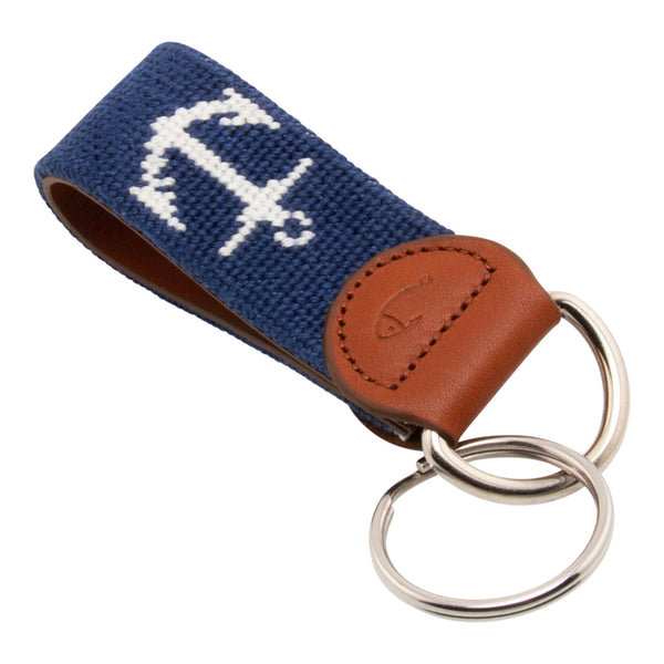 Hand-stitched needlepoint keychain, ship's anchor design in white on both sides with navy blue background high-quality leather and cotton thread, stainless steel D-ring and keyring.