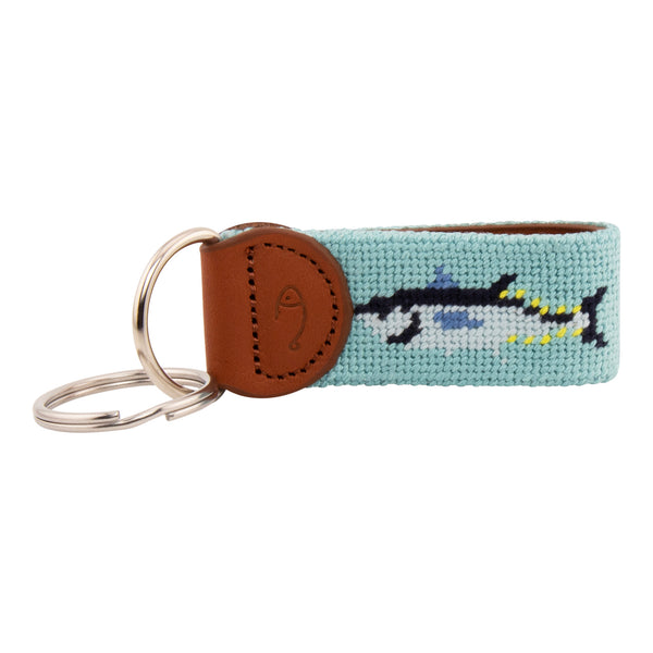 Hand-stitched bluefin tuna needlepoint keychain showing a bluefin tuna on both sides against a light blue background and leather backing.  Stainless steel D-ring and keyring.