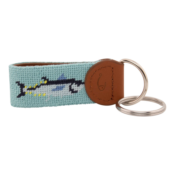 Hand-stitched bluefin tuna needlepoint keychain showing a bluefin tuna on both sides against a light blue background and leather backing.  Stainless steel D-ring and keyring.