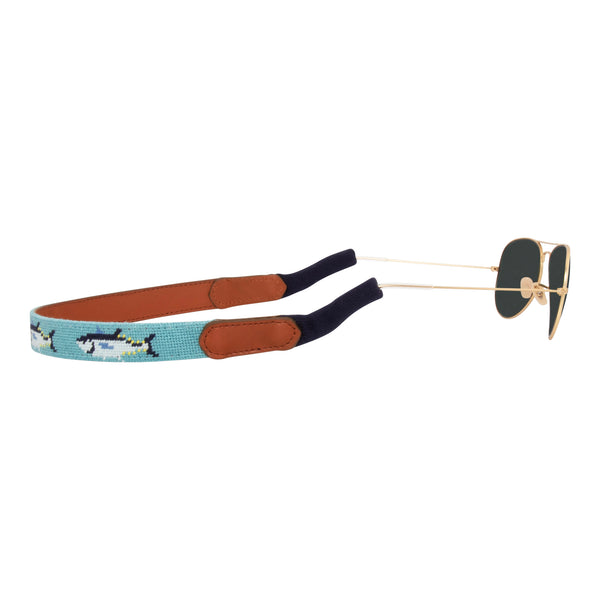 Side view bluefin tuna themed needlepoint sunglass strap showing a bluefin tuna design against a sea blue background with sturdy cotton covered silicone ear connectors and a soft leather backing