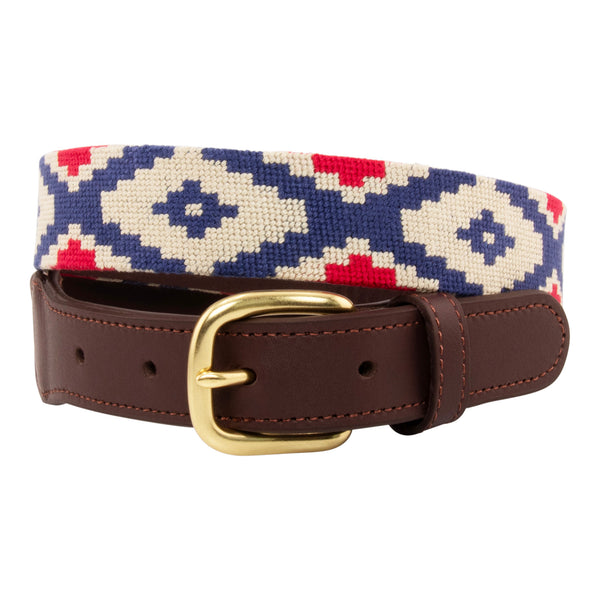 Gaucho Needlepoint Belt showing a gaucho pattern in red white and blue. Belt has a brass buckle and full grain leather backing and strap.