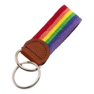 Hand-stitched rainbow needlepoint keychain showing a rainbow pattern on both sides and leather backing.  Stainless steel D-ring and keyring.