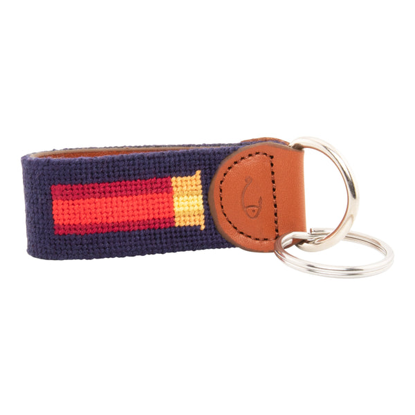 Hand-stitched shotgun shell needlepoint keychain showing a classic red shotgun shell on both sides against a navy blue background and leather backing.  Stainless steel D-ring and keyring.