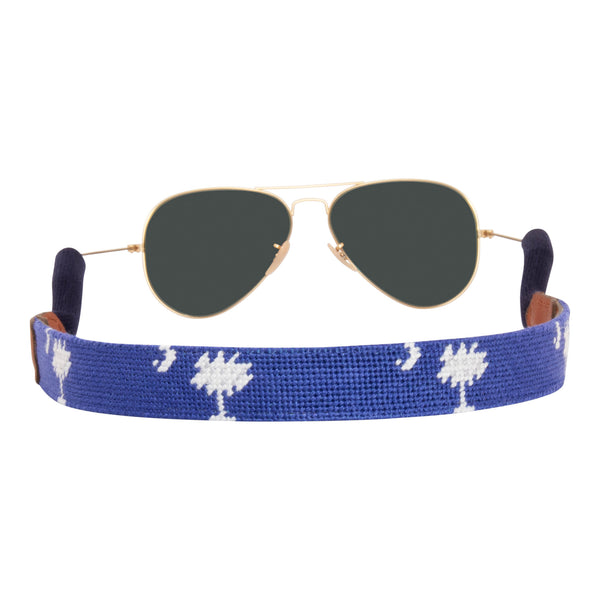 Back Side Hand-stitched South Carolina Flag needlepoint sunglass strap showing palmetto and crescent against a blue background with sturdy cotton covered silicone ear connectors and a soft leather backing